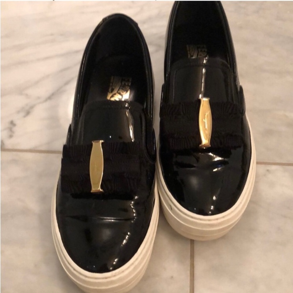 Salvatore Ferragamo 7.5 black patent leather sneaker with a bow